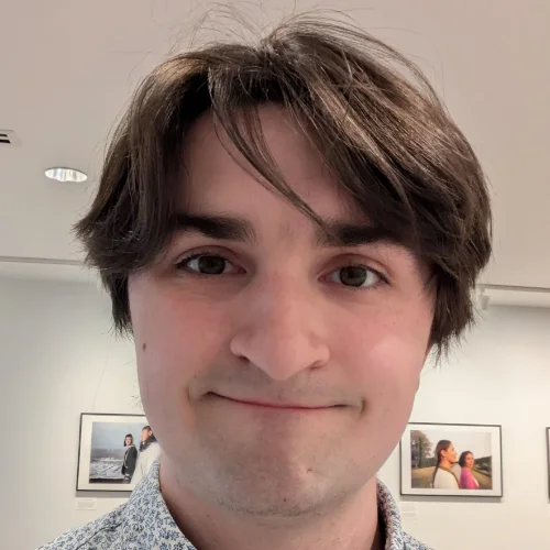 A close-up photo of Benny Mayer, a young man