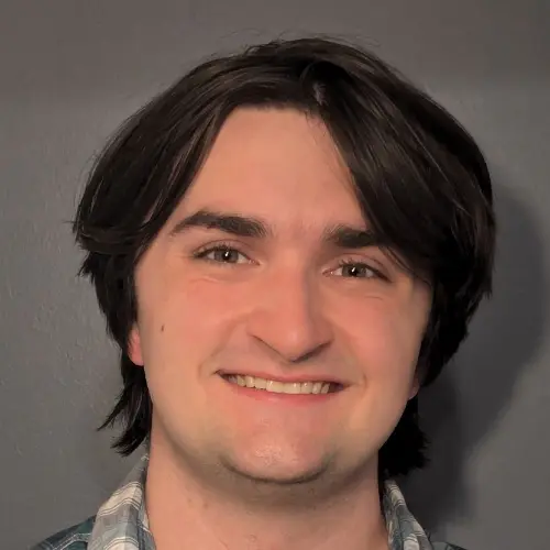 A close-up photo of Benny Mayer, a young man